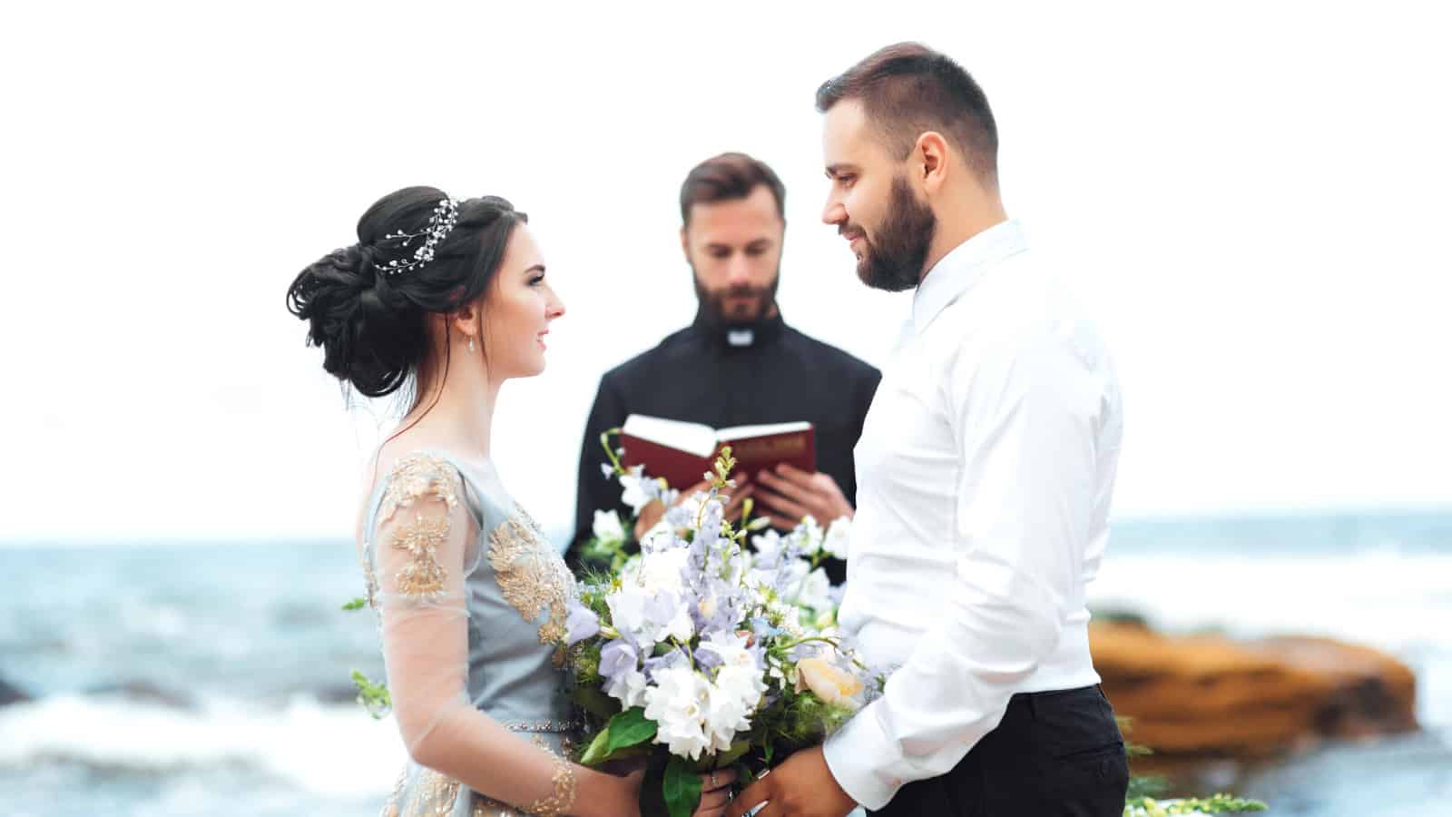 Bride and Groom Exchanging Vows at a Beach Wedding