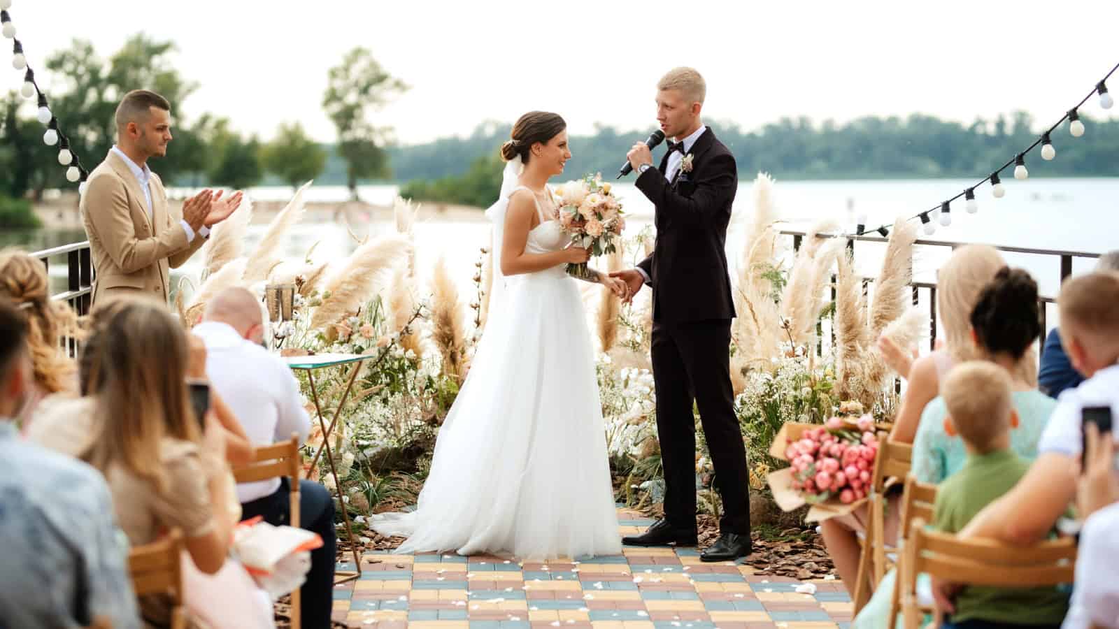 wedding ceremony on a high pier near the river