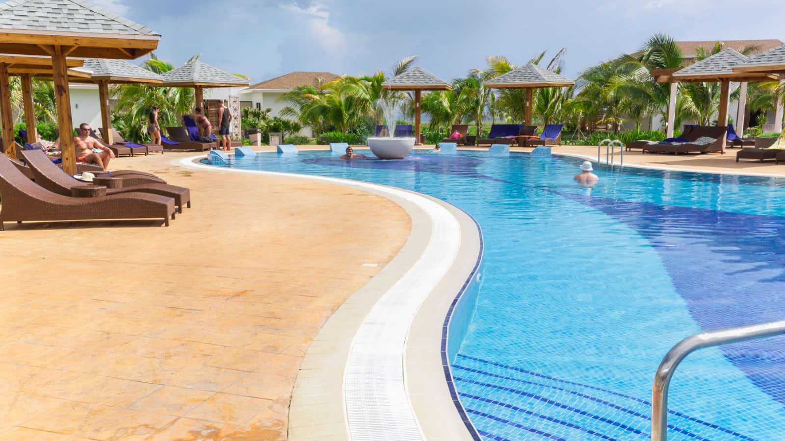 Nice view of comfortable cozy curved swimming pool