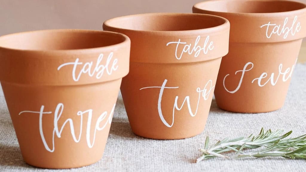 Hand-Lettered Terracotta Plant Pot Table Number