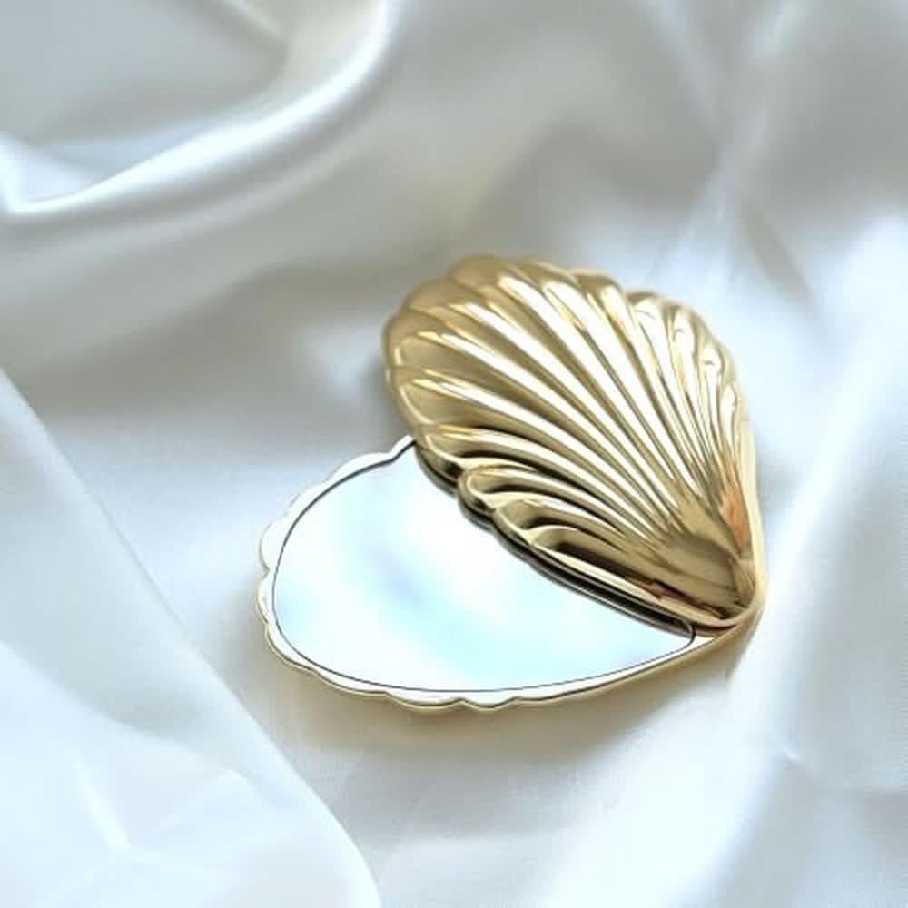 Rotating Seashell Compact Mirror